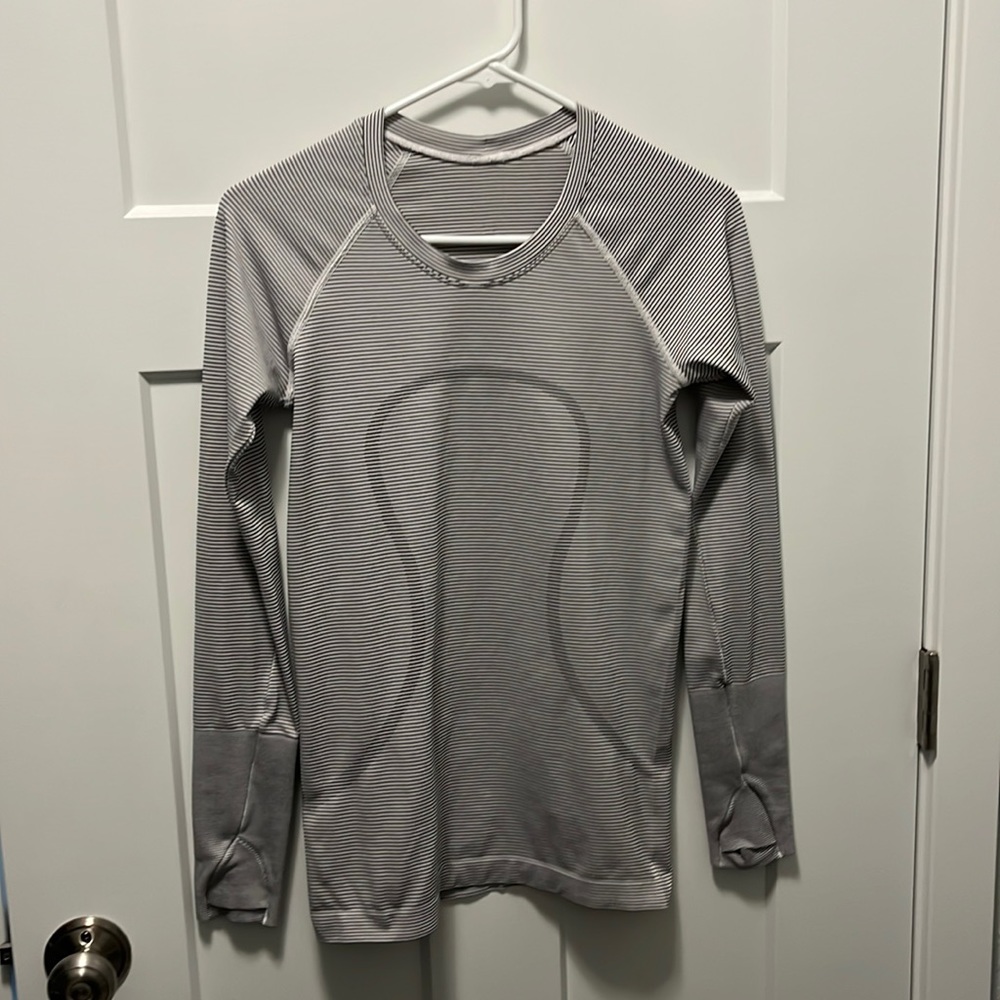 Lululemon Swiftly Tech long sleeve gray with dark gray pinstripes. Hardly worn.
